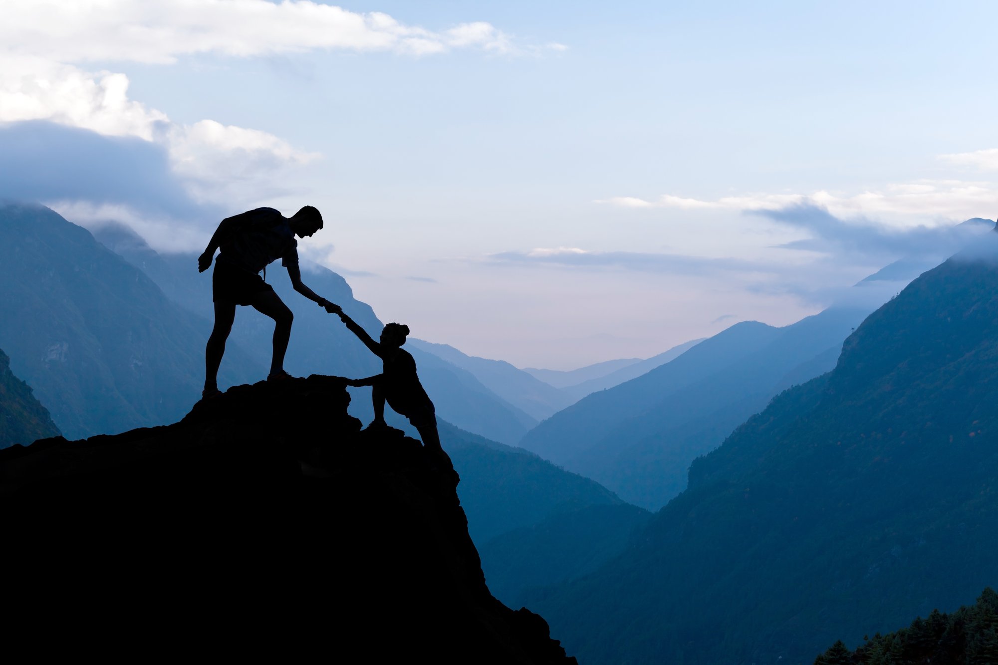 bigstock-Teamwork-Couple-Climbing-Helpi-91037114